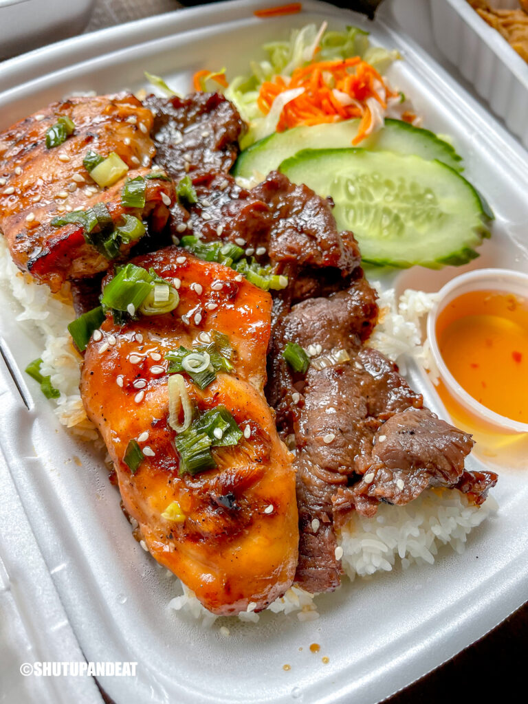 grilled beef and chicken on rice and salad